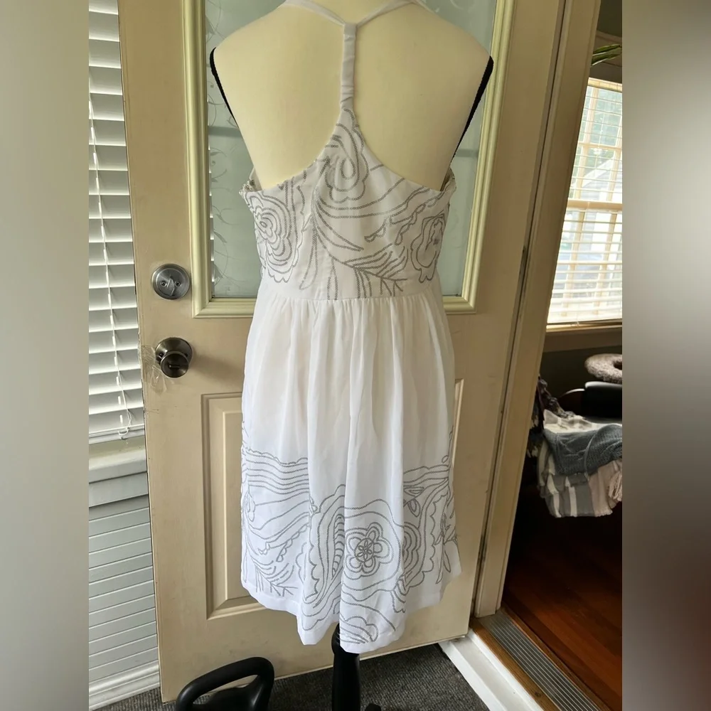 Johnny Martin size L white and silver floral Sequined dress. Racer back ruffled